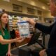 Manager distributing float cash in Adsure tamper-evident bag before store opening